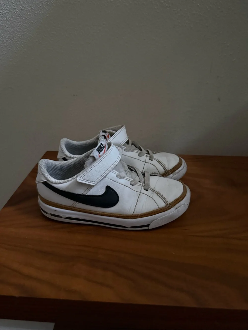 Nike Kids White Sneakers with Black Swoosh and Tan Trim